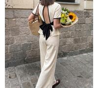 Set elegante e casual da donna composto da top a maniche corte con vita stretta, schiena traforata, fiocco nero e orlo floreale a contrasto, abbinato a pantaloni a gamba dritta, colore albicocca, stil