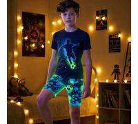 Set pigiama da ragazzo tween con stampa grafica che brilla al buio, 2 pezzi - include maglietta girocollo con stampa di un calciatore e pantaloncini abbinati con stampa all-over, vestibilità aderente,