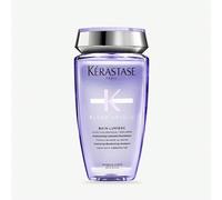 Shampoo Blond Absolu Bain Lumiere 250ml Riaccendi il tuo colore con Kérastase Blond Absolu Bain Lumiere Shampoo, un detergente nutriente ideale per capelli schiariti, con mèches o grigi.La formula del