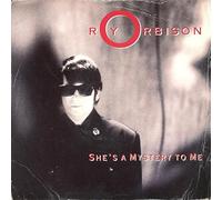 SHE'S A MYSTERY TO ME 7" (VINYL 45) GERMAN VIRGIN 1989