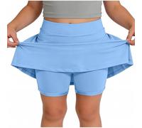 Skort beige da ragazza con sovrapposizione svasata e pantaloncini integrati | Una gonna beige pallido combina una vita liscia, una gonna svasata sovrapposta e pantaloncini aderenti visibili sotto l'orlo
