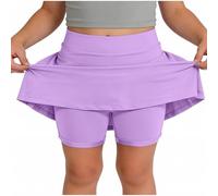 Skort beige da ragazza con sovrapposizione svasata e pantaloncini integrati | Una gonna beige pallido combina una vita liscia, una gonna svasata sovrapposta e pantaloncini aderenti visibili sotto l'orlo