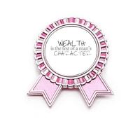 Spilla rosa con citazione "Wealth Is The Test Of A Man's Character", Medio, Metallo