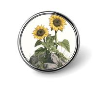 Spilla rotonda con girasoli che crescono tra rocce grigie