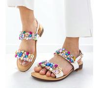 STYLEE FOOTWEAR Sandali bassi da donna con dettagli eleganti. Questi sandali presentano un design sofisticato e decorazioni luccicanti che aggiungono un tocco unico ed elegante. Il tacco basso e comod