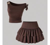 Tuta da ragazza adolescente in 2 pezzi, con maglia girocollo in maglia jacquard blu casual e comoda, abbinata a una gonna a due balze. La vita e l'orlo arricciati della maglia creano un aspetto comple