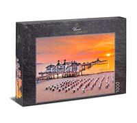 Ulmer Puzzleschmiede - Puzzle "Sole serale su Rügen" - Sedie da spiaggia sul Mar Baltico al tramonto - Isola di Rügen, Germania