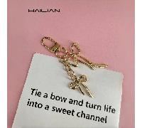 Un portachiavi con fiocco, semplice e versatile, realizzato in lega metallica, adatto come piccolo regalo per la tua migliore amica, fiocchi estivi Lega di zinco