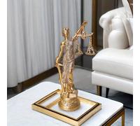 Una statua in resina di giustizia, equità e imparzialità, della dea greca e romana, che tiene una bilancia simbolo di giustizia assoluta, per l'ufficio di casa Tagli UnicaABS