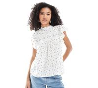 Vero Moda - Top accollato a fiorellini con maniche con volant e ricamo-Bianco L