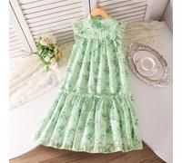 Vestito verde con fiorellini per ragazza pre-adolescente. Un capo di abbigliamento estivo per bambini, con uno stile "principessa" ed un aspetto "fresco ed elegante", adatto per la spiaggia, le uscite