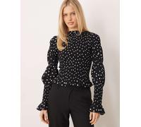 YAS - Top grembiule accollato a maniche lunghe nero a pois bianchi XS